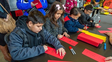 Kids learning how to write Chinese characters