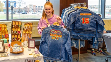 Kid Makers Market craft vendor selling Kansas City themed jean jackets