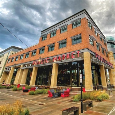 Exterior of Public Market with dark clouds by Greg Turcotte