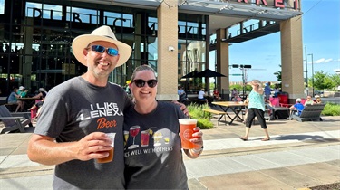 Couple drinking beer outside the Public Market